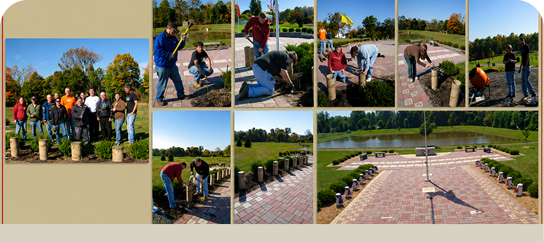 People planting trees in a park area.