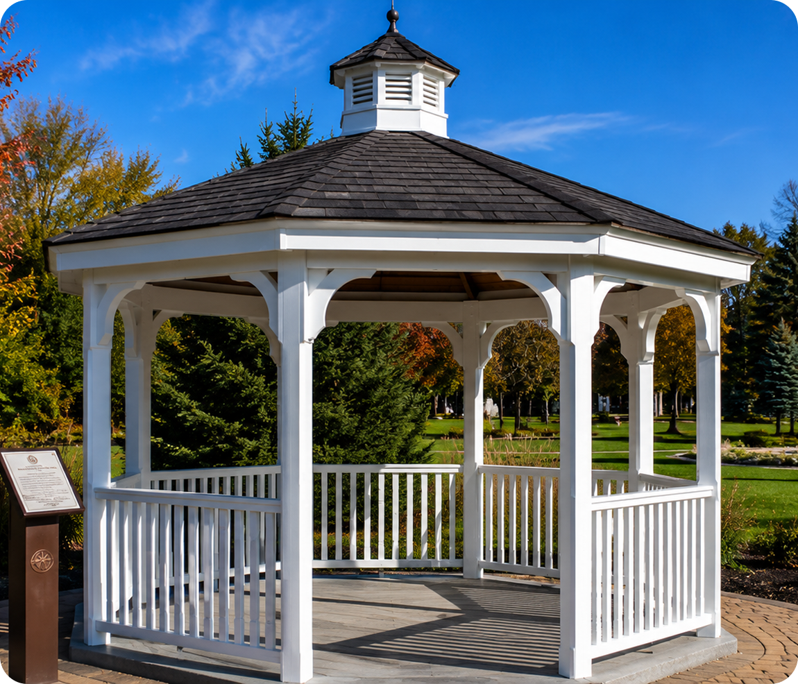 White gazebo in a sunny park setting.