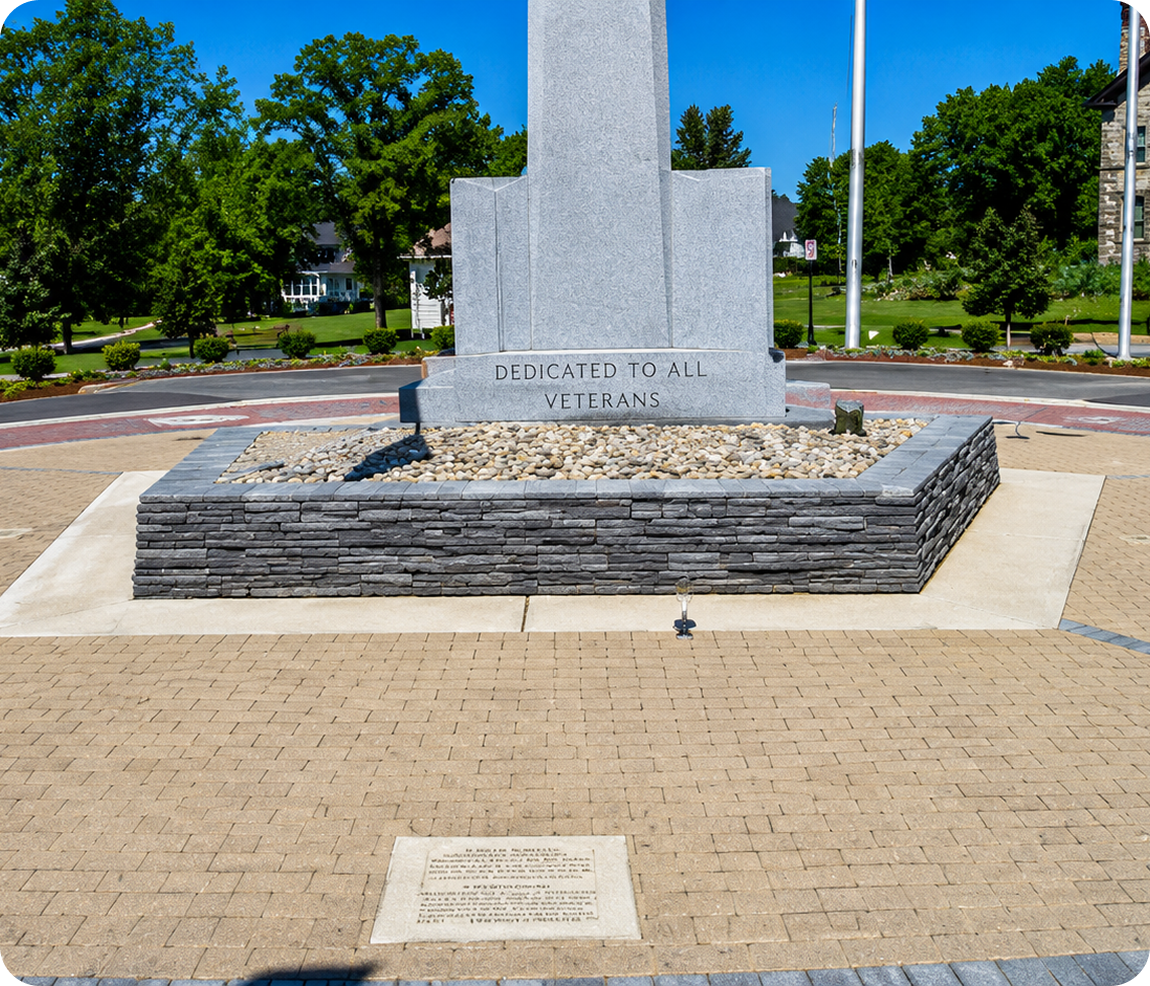 Veterans memorial with stone monument and plaque.