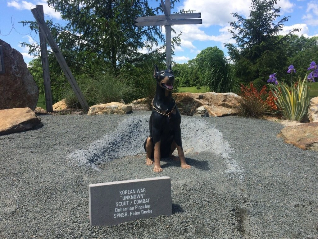 Outdoor sculpture of a Doberman dog